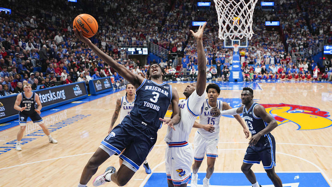 Jan 31, 2026; Lawrence, Kansas, USA; BYU Cougars forward AJ Dybantsa (3) shoots against Kansas Jayhawks forward Flory Bidunga (40) during the second half at Allen Fieldhouse. Mandatory Credit: Jay Biggerstaff-Imagn Images