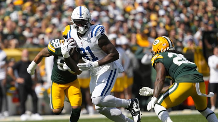 Indianapolis Colts tight end Mo Alie-Cox (81) runs with the football between Green Bay Packers linebacker Isaiah McDuffie (58) and safety Javon Bullard (20) during the third quarter at Lambeau Field.