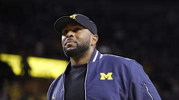Jan 19, 2025; Ann Arbor, Michigan, USA;  Michigan Wolverines head football coach Sherrone Moore fires up the crowd in overtime of the basketball game against the Northwestern Wildcats at Crisler Center. Mandatory Credit: Rick Osentoski-Imagn Images