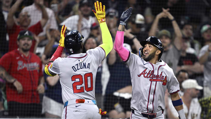 Jul 12, 2024; San Diego, California, USA; Atlanta Braves designated hitter Marcell Ozuna (20) is congratulated by left fielder Eddie Rosario (8) after hitting a home run against the San Diego Padres during the ninth inning at Petco Park. Mandatory Credit: Orlando Ramirez-USA TODAY Sports 