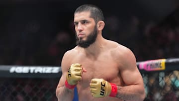 Jun 1, 2024; Newark, New Jersey, USA; Islam Makhachev (red gloves) fights Dustin Poirier (blue gloves) during UFC 302 at Prudential Center. Mandatory Credit: Joe Camporeale-Imagn Images