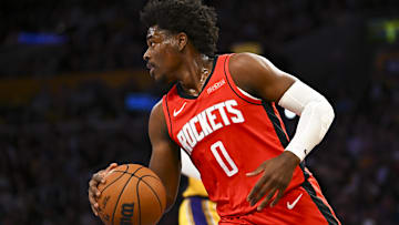 Houston Rockets guard Aaron Holiday (0) moves the ball against the Los Angeles Lakers during the first half at Crypto.com Arena.