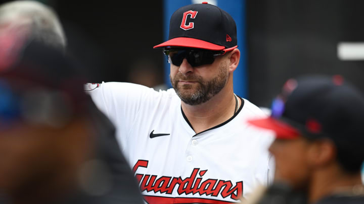 Jul 21, 2024; Cleveland, Ohio, USA; Cleveland Guardians manager Stephen Vogt (12) watches form the dugout during the sixth inning against the San Diego Padres at Progressive Field. Mandatory Credit: Ken Blaze-USA TODAY Sports