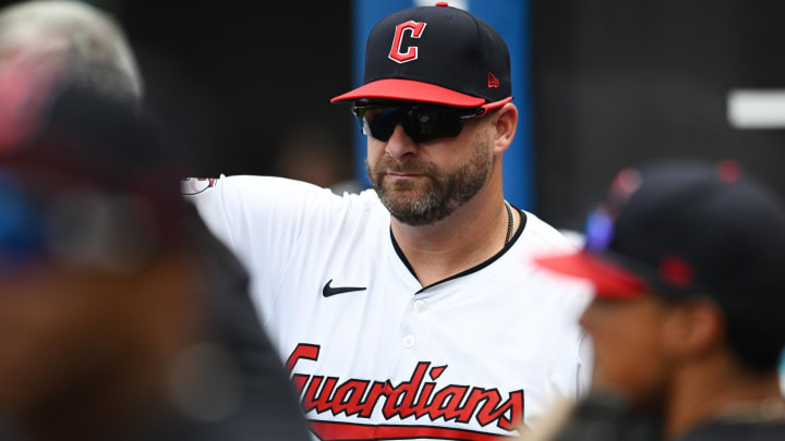 Jul 21, 2024; Cleveland, Ohio, USA; Cleveland Guardians manager Stephen Vogt (12) watches form the dugout during the sixth inning against the San Diego Padres at Progressive Field. Mandatory Credit: Ken Blaze-USA TODAY Sports