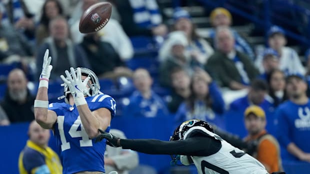 Colts wide receiver Alec Pierce (blue jersey) gets ready to haul in a deep pass from the quarterback.
