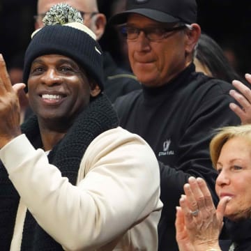 Jan 13, 2024; Boulder, Colorado, USA; Colorado Buffaloes football head coach Deion Sanders cheers in the second half of the game against the USC Trojans at the CU Events Center. Mandatory Credit: Ron Chenoy-USA TODAY Sports
