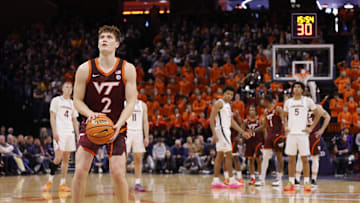 Feb 1, 2025; Charlottesville, Virginia, USA; Virginia Tech Hokies guard Jaden Schutt (2) takes a foul shot as the Virginia Cavaliers look on during the first half at John Paul Jones Arena. Mandatory Credit: Amber Searls-Imagn Images