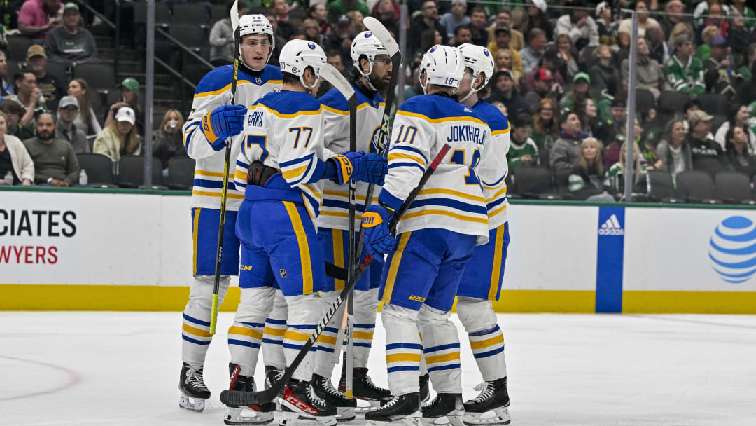 Apr 9, 2024; Dallas, Texas, USA; Buffalo Sabres center Tage Thompson (72) and right wing JJ Peterka (77) and right wing Alex Tuch (89) and defenseman Henri Jokiharju (10) celebrates a goal scored by Tuch against the Dallas Stars during the first period at the American Airlines Center. Mandatory Credit: Jerome Miron-USA TODAY Sports