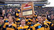 Nov 23, 2024; Berkeley, California, USA; The California Golden Bears axe committee holds up the axe trophy on the field after the game against the Stanford Cardinal at California Memorial Stadium. Mandatory Credit: Darren Yamashita-Imagn Images
