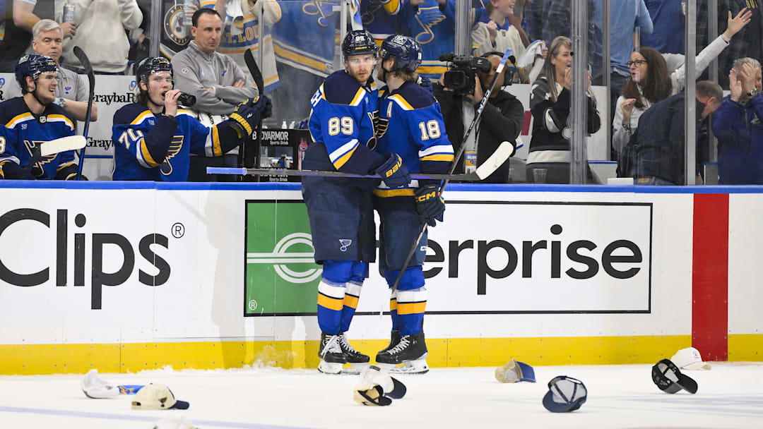 Apr 24, 2025; St. Louis, Missouri, USA; St. Louis Blues left wing Pavel Buchnevich (89) is congratulated by center Robert Thomas (18) after recording a hat trick against the Winnipeg Jets during the third period in game three of the first round of the 2025 Stanley Cup Playoffs at Enterprise Center. Mandatory Credit: Jeff Curry-Imagn Images