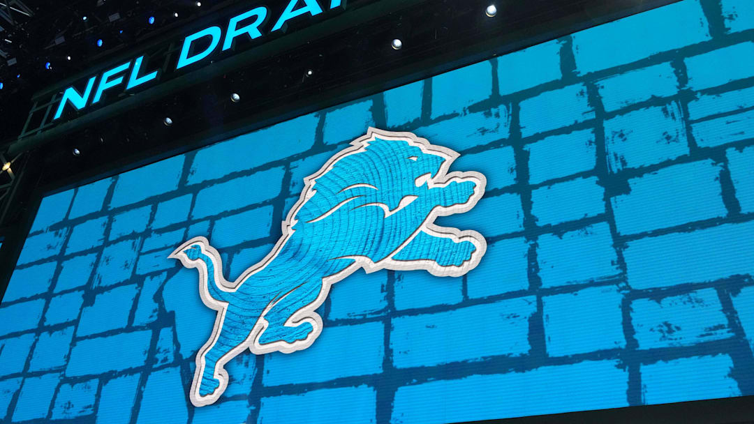 The Detroit Lions logo is projected on draft stage screen during the 2025 NFL Draft at Lambeau Field