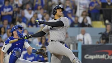 Oct 26, 2024; Los Angeles, California, USA; New York Yankees outfielder Juan Soto (22) hits a solo home run in the third inning against the Los Angeles Dodgers during game two of the 2024 MLB World Series at Dodger Stadium. Mandatory Credit: Jayne Kamin-Oncea-Imagn Images