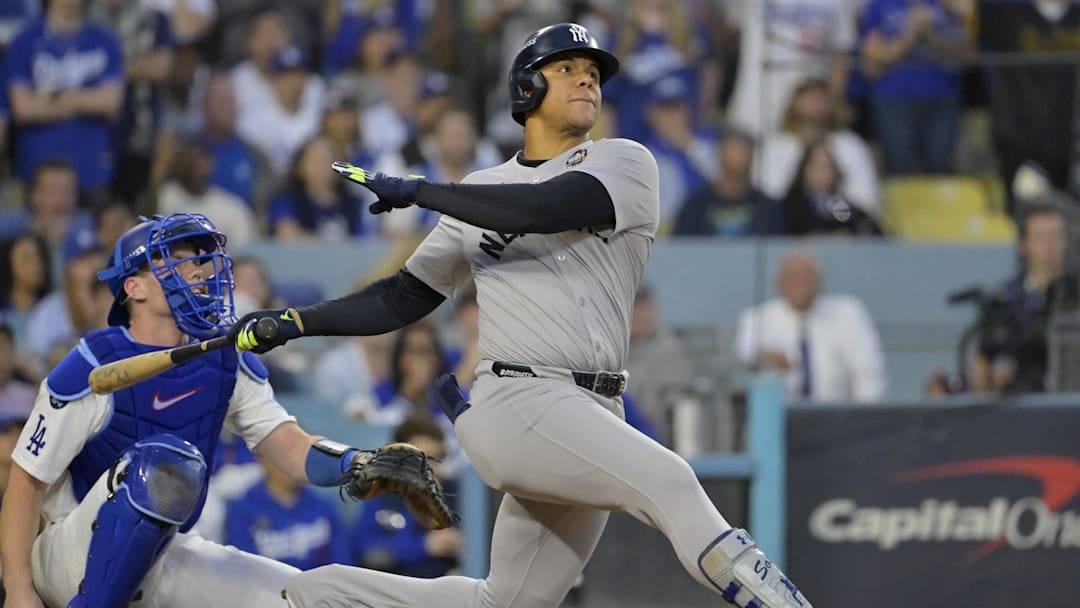 Oct 26, 2024; Los Angeles, California, USA; New York Yankees outfielder Juan Soto (22) hits a solo home run in the third inning against the Los Angeles Dodgers during game two of the 2024 MLB World Series at Dodger Stadium. Mandatory Credit: Jayne Kamin-Oncea-Imagn Images