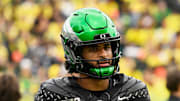 Oct 11, 2025; Eugene, Oregon, USA; Oregon Ducks quarterback Dante Moore (5) looks on during warmups before the game against the Indiana Hoosiers at Autzen Stadium. Mandatory Credit: Troy Wayrynen-Imagn Images