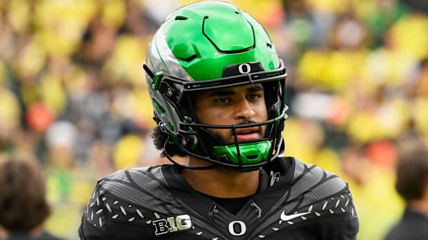 oregon ducks dante moore dan lanning heisman trophy quarterback indiana hoosiers fernando mendoza carson beck john mateer