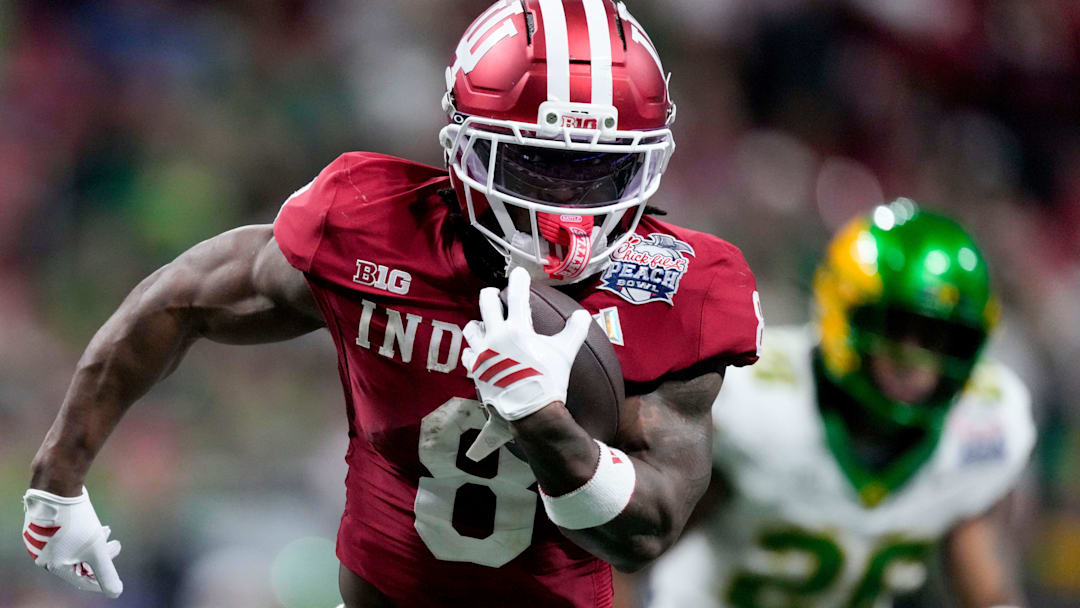 Indiana Hoosiers running back Kaelon Black (8) rushes the ball for a touchdown Friday, Jan. 9, 2026, during the Peach Bowl and semifinal game of the College Football Playoff against the Oregon Ducks at Mercedes-Benz Stadium in Atlanta.