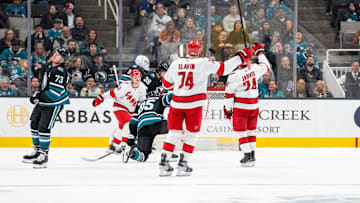 Mar 20, 2025; San Jose, California, USA; Carolina Hurricanes center Seth Jarvis (24) and Carolina Hurricanes defenseman Jaccob Slavin (74) and teammates celebrate after the goal against the San Jose Sharks during the second period at SAP Center at San Jose. Mandatory Credit: Neville E. Guard-Imagn Images