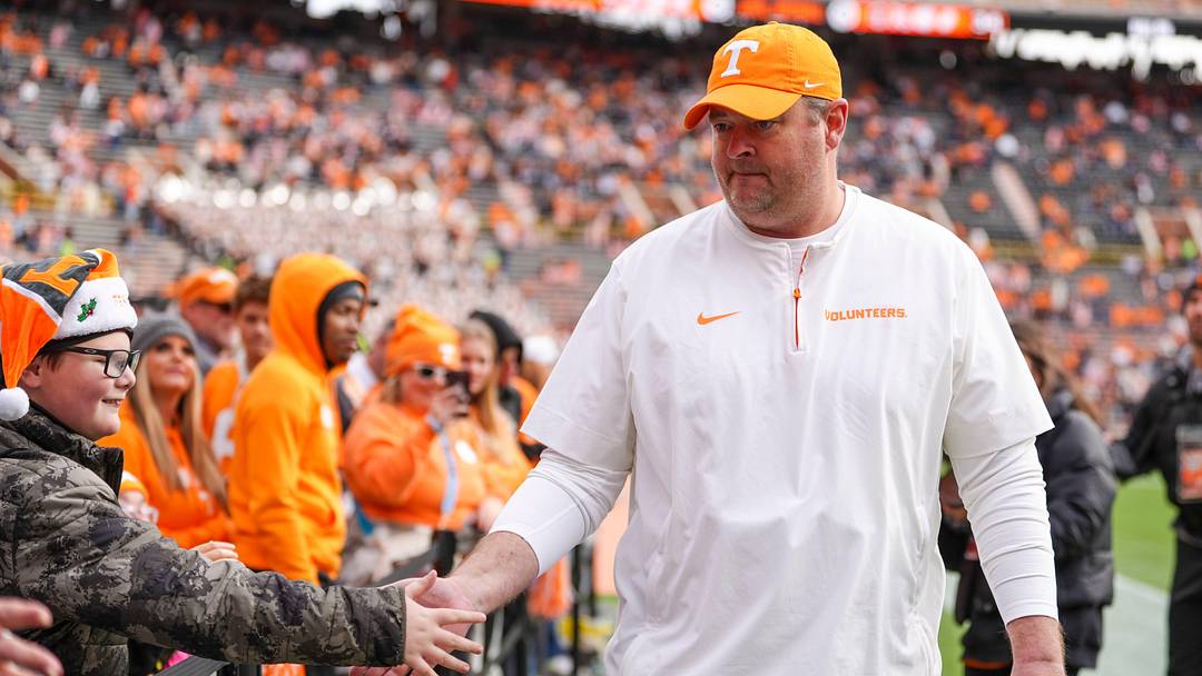 Tennessee coach Josh Heupel high-fives children from East Tennessee Children's Hospital during warm-ups at a NCAA football game between Tennessee and Vanderbilt at Neyland Stadium in Knoxville, Tenn., on Nov. 29, 2025.