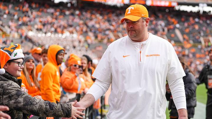Tennessee coach Josh Heupel high-fives children from East Tennessee Children's Hospital during warm-ups at a NCAA football game between Tennessee and Vanderbilt at Neyland Stadium in Knoxville, Tenn., on Nov. 29, 2025.