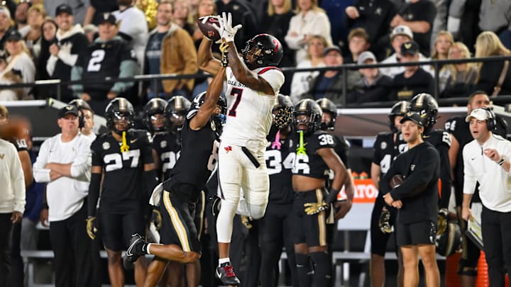 Oct 19, 2024; Nashville, Tennessee, USA;  Ball State Cardinals wide receiver Cam Pickett (7) makes a catch over Vanderbilt Commodores cornerback Tyson Russell (8) during the second half at FirstBank Stadium. Mandatory Credit: Steve Roberts-Imagn Images