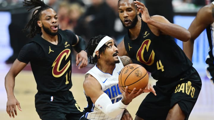 Apr 30, 2024; Cleveland, Ohio, USA; Orlando Magic guard Gary Harris (14) drives to the basket against Cleveland Cavaliers forward Evan Mobley (4) during the first quarter in game five of the first round for the 2024 NBA playoffs at Rocket Mortgage FieldHouse. Mandatory Credit: Ken Blaze-USA TODAY Sports