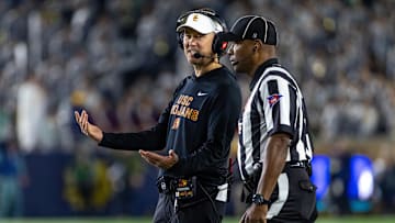 Oct 18, 2025; South Bend, Indiana, USA; Southern California Trojans head coach Lincoln Riley talks to an official during the first half against the Notre Dame Fighting Irish at Notre Dame Stadium. Mandatory Credit: Michael Caterina-Imagn Images