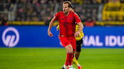 Harry Kane e Bensebaini são dois dos principais destaques em suas equipes