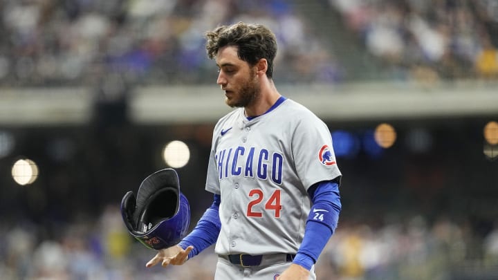 Jun 28, 2024; Milwaukee, Wisconsin, USA;  Chicago Cubs right fielder Cody Bellinger (24) flips his helmet after being involved in a double play during the sixth inning against the Milwaukee Brewers at American Family Field. Mandatory Credit: Jeff Hanisch-USA TODAY Sports