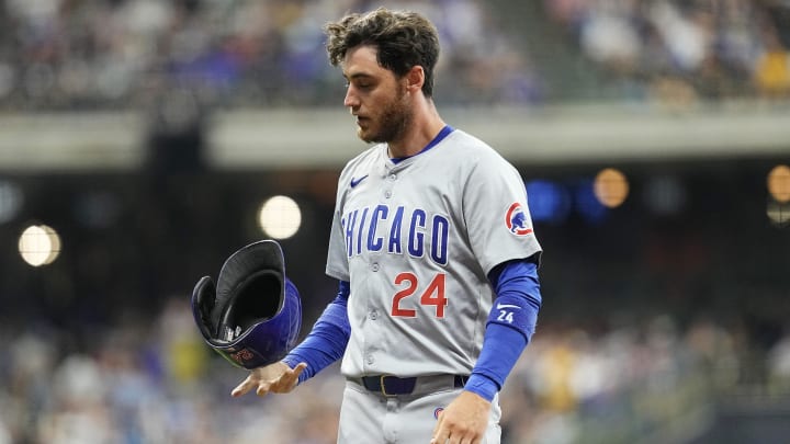 Jun 28, 2024; Milwaukee, Wisconsin, USA;  Chicago Cubs right fielder Cody Bellinger (24) flips his helmet after being involved in a double play during the sixth inning against the Milwaukee Brewers at American Family Field