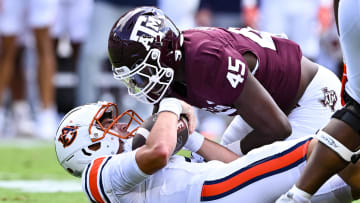 Sep 23, 2023; College Station, Texas, USA; Texas A&M Aggies linebacker Edgerrin Cooper (45) sacks Auburn Tigers quarterback Payton Thorne (1) during the first quarter at Kyle Field. Mandatory Credit: Maria Lysaker-USA TODAY Sports