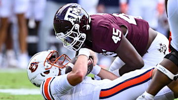 Sep 23, 2023; College Station, Texas, USA; Texas A&M Aggies linebacker Edgerrin Cooper (45) sacks Auburn Tigers quarterback Payton Thorne (1) during the first quarter at Kyle Field. Mandatory Credit: Maria Lysaker-Imagn Images