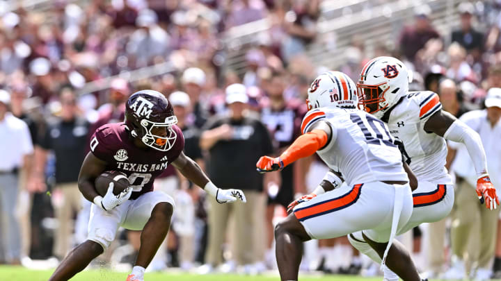 Sep 23, 2023; College Station, Texas, USA; Texas A&M Aggies wide receiver Ainias Smith (0) runs the ball during the third quarter against the Auburn Tigers at Kyle Field. Mandatory Credit: Maria Lysaker-USA TODAY Sports