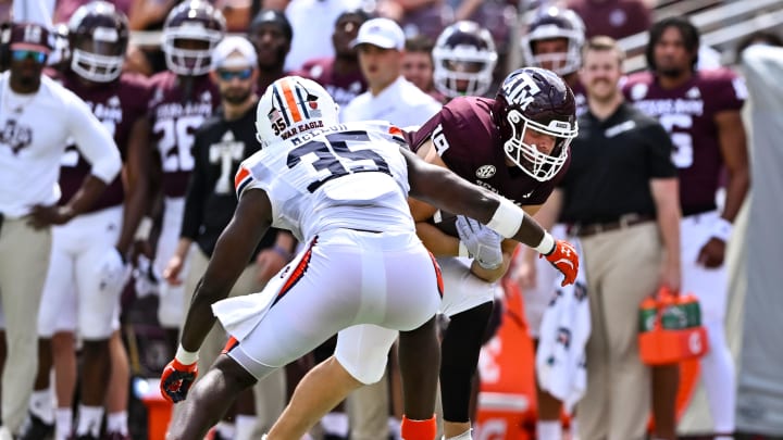 Sep 23, 2023; College Station, Texas, USA; Auburn Tigers linebacker Jalen McLeod (35) tackles Texas A&M Aggies tight end Jake Johnson (19) during the third quarter at Kyle Field. Mandatory Credit: Maria Lysaker-USA TODAY Sports