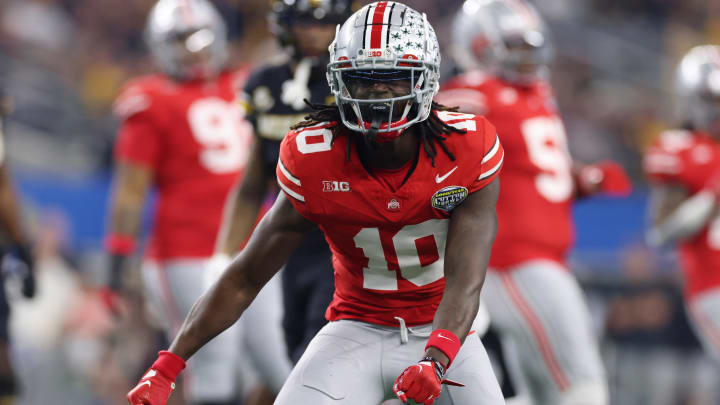 Dec 29, 2023; Arlington, TX, USA;  Ohio State Buckeyes cornerback Denzel Burke (10) reacts after making a tackle against the Missouri Tigers in the first quarter at AT&T Stadium.