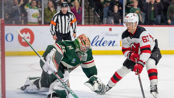 Feb 11, 2023; Saint Paul, Minnesota, USA; Minnesota Wild goaltender Filip Gustavsson (32) makes a save against New Jersey Devils left wing Jesper Bratt (63) in shootouts at Xcel Energy Center. Mandatory Credit: Matt Blewett-Imagn Images
