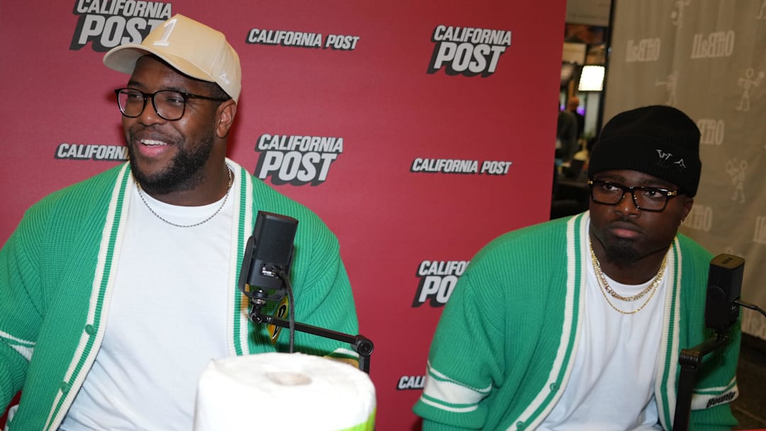 Feb 4, 2026; San Francisco, CA, USA; Los Angeles Rams defensive end Kobie Turner (left) and linebacker Byron Young at the California Post booth at the Super Bowl LX media center at the Moscone Center. Mandatory Credit: Kirby Lee-Imagn Images