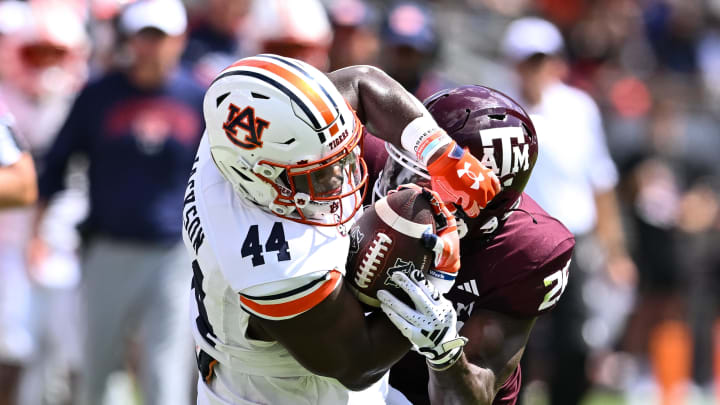 Sep 23, 2023; College Station, Texas, USA; Texas A&M Aggies defensive back Demani Richardson (26) tackles Auburn Tigers running back Sean Jackson (44) during the fourth quarter at Kyle Field. Mandatory Credit: Maria Lysaker-USA TODAY Sports