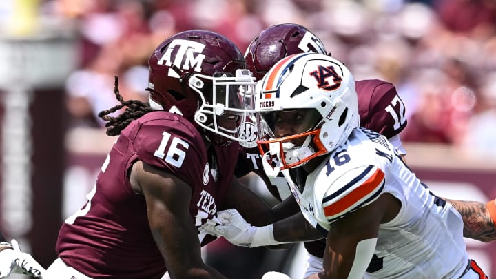 Sep 23, 2023; College Station, Texas, USA; Auburn Tigers wide receiver Malcolm Johnson Jr. (16) and Texas A&M Aggies quarterback Jaylen Henderson (16) in action on punt return during the third quarter at Kyle Field. Mandatory Credit: Maria Lysaker-USA TODAY Sports