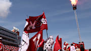 Utah Utes students run out on the field ahead of the team before the game against the Baylor Bears at Rice-Eccles Stadium. 