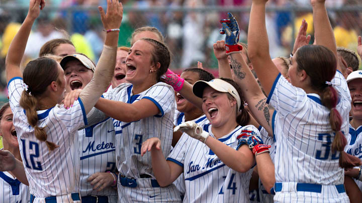 Van Meter players celebrate after defeating East Marshall during the 2025 Iowa high school state softball tournament at Harlan Rogers Sports Complex on July 22, 2025, in Fort Dodge.