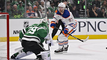 Dallas Stars goaltender Jake Oettinger (29) and Edmonton Oilers center Connor McDavid (97)
