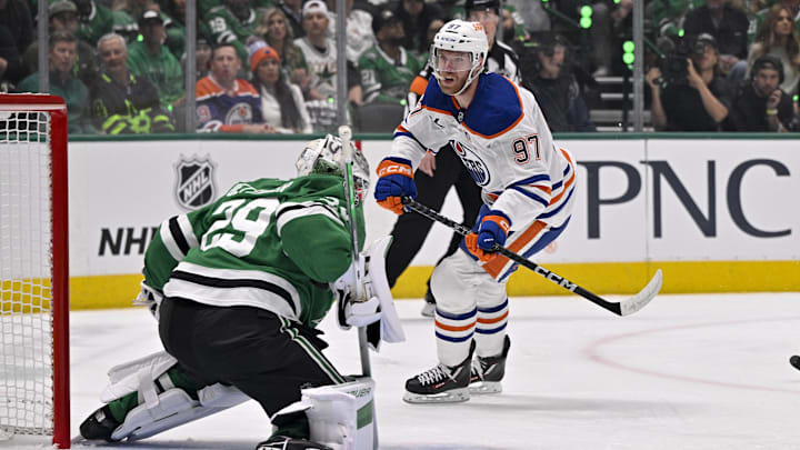 Dallas Stars goaltender Jake Oettinger (29) and Edmonton Oilers center Connor McDavid (97)