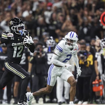 Dec 28, 2024; San Antonio, TX, USA; Colorado Buffaloes wide receiver Travis Hunter (12) runs with the ball during the second quarter against the Brigham Young Cougars at Alamodome. Mandatory Credit: Troy Taormina-Imagn Images