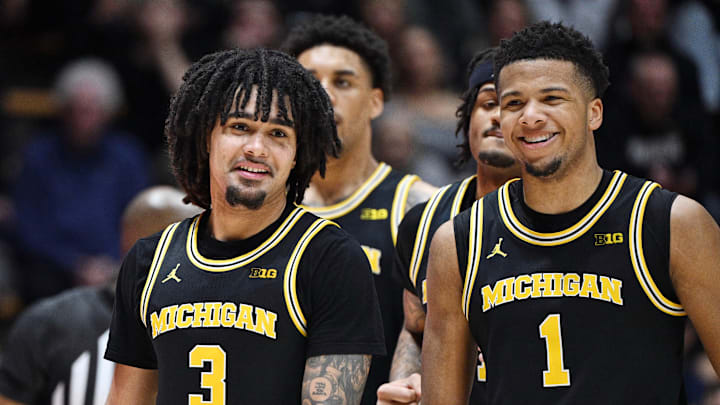 Feb 17, 2026; West Lafayette, Indiana, USA; Michigan Wolverines guard Elliot Cadeau (3) shares a moment with Michigan Wolverines guard Trey McKenney (1) during the second half against the Purdue Boilermakers at Mackey Arena. Feb 17, 2026; West Lafayette, Indiana, USA; Michigan Wolverines guard Elliot Cadeau (3) shares a moment with Michigan Wolverines guard Trey McKenney (1) during the second half against the Purdue Boilermakers at Mackey Arena.