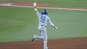 Nov 1, 2025; Toronto, Ontario, CAN; Los Angeles Dodgers second baseman Miguel Rojas (72) celebrates as he runs the bases after hitting a home run against the Toronto Blue Jays in the ninth inning during game seven of the 2025 MLB World Series at Rogers Centre. Mandatory Credit: Kevin Sousa-Imagn Images