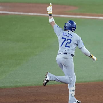 Nov 1, 2025; Toronto, Ontario, CAN; Los Angeles Dodgers second baseman Miguel Rojas (72) celebrates as he runs the bases after hitting a home run against the Toronto Blue Jays in the ninth inning during game seven of the 2025 MLB World Series at Rogers Centre. Mandatory Credit: Kevin Sousa-Imagn Images