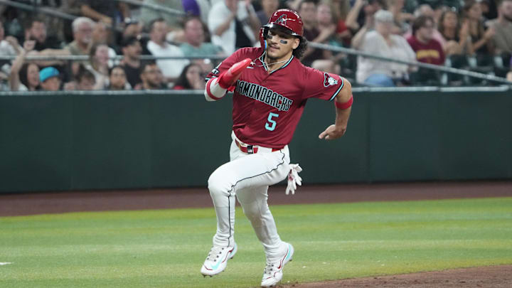 Jun 10, 2025; Phoenix, Arizona, USA; Arizona Diamondbacks outfielder Alek Thomas (5) rounds third base and scores a run against the Seattle Mariners during the third inning at Chase Field. Mandatory Credit: Joe Camporeale-Imagn Images