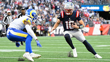 Nov 17, 2024; Foxborough, Massachusetts, USA; New England Patriots quarterback Drake Maye (10) prepares to take a hit from Los Angeles Rams safety Kamren Curl (3) during the second half at Gillette Stadium. Mandatory Credit: Eric Canha-Imagn Images