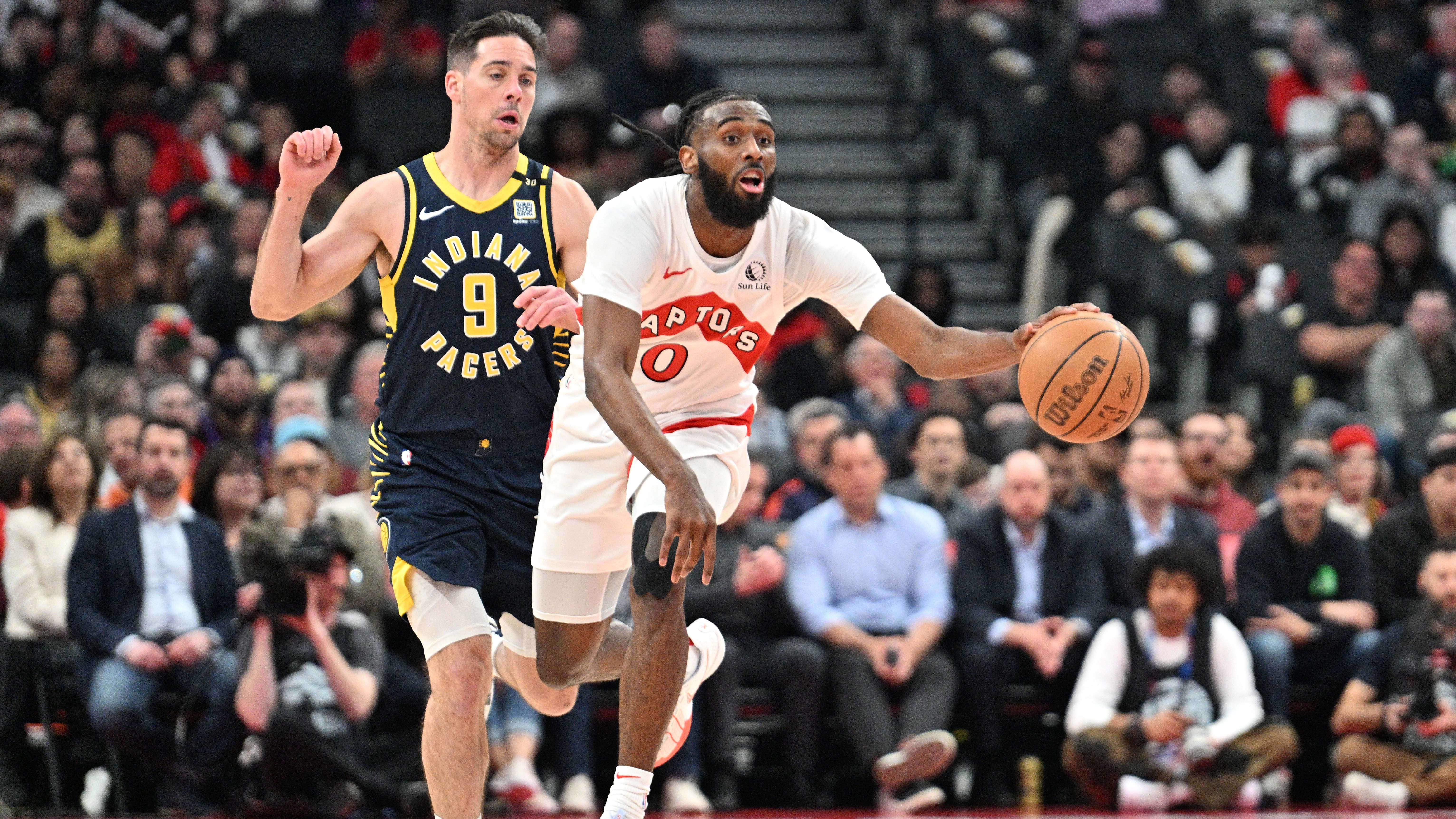 Apr 9, 2024; Toronto, Ontario, CAN;   Toronto Raptors guard Javon Freeman-Liberty (0) dribbles the