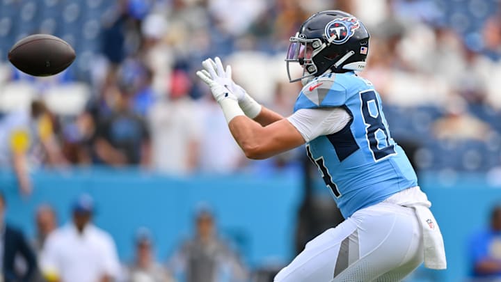 Sep 14, 2025; Nashville, Tennessee, USA; Tennessee Titans tight end Gunnar Helm (84) makes a catch against the Los Angeles Rams during pre-game warmups at Nissan Stadium. Mandatory Credit: Steve Roberts-Imagn Images Sep 14, 2025; Nashville, Tennessee, USA; Tennessee Titans tight end Gunnar Helm (84) makes a catch against the Los Angeles Rams during pre-game warmups at Nissan Stadium. Mandatory Credit: Steve Roberts-Imagn Images